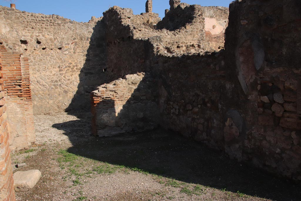 VII.14.1 Pompeii. October 2022. 
Looking north across shop to doorway to rear room, with entrance at VII.14.20 in its west wall. Photo courtesy of Klaus Heese.