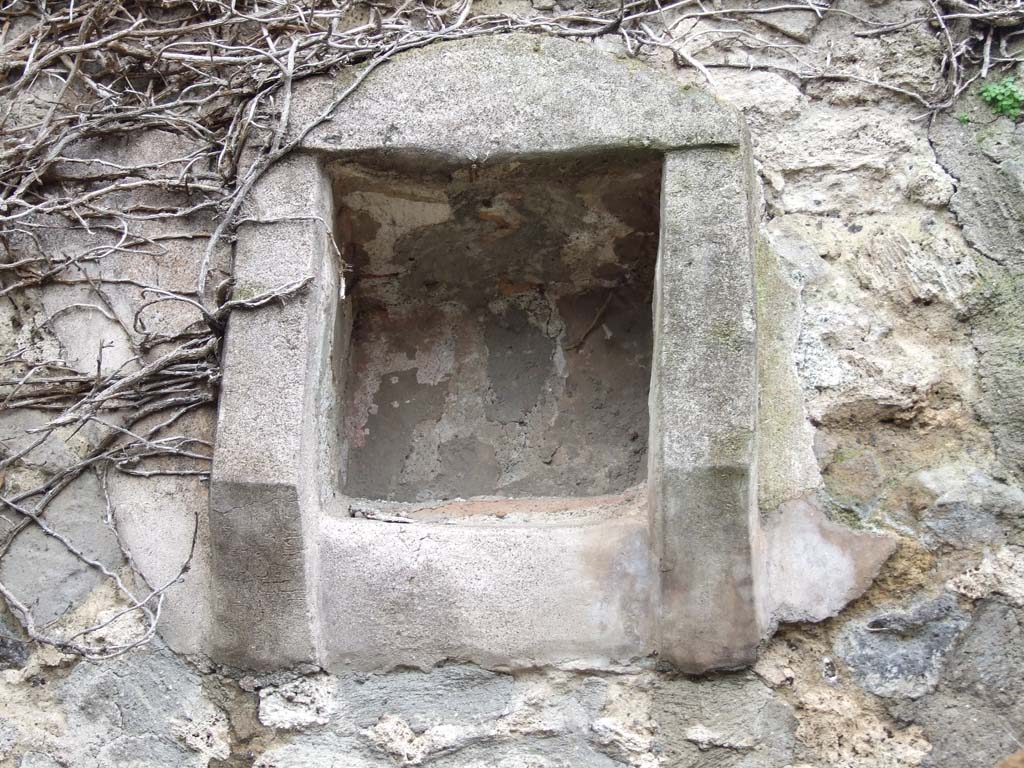VII.14.5 Pompeii. March 2009. Room 18, niche in south wall of kitchen.
According to Boyce, in the large kitchen entered from the posticum at VII.14.19, high up on the south wall, was a square niche.
According to Fiorelli, this was “la piccola nicchia dei Penati”.
Boyce gave the reference - Fiorelli, Descr., 302.
See Boyce G. K., 1937. Corpus of the Lararia of Pompeii. Rome: MAAR 14. (p.71, no.327) 
See Giacobello, F., 2008. Larari Pompeiani: Iconografia e culto dei Lari in ambito domestico. Milano: LED Edizioni, (p.195, no.81)