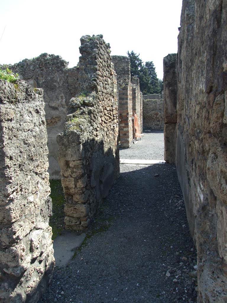 VII.14.9 Pompeii. March 2009. 
Room 11, looking south along corridor to atrium, with doorway in east wall to room 12.