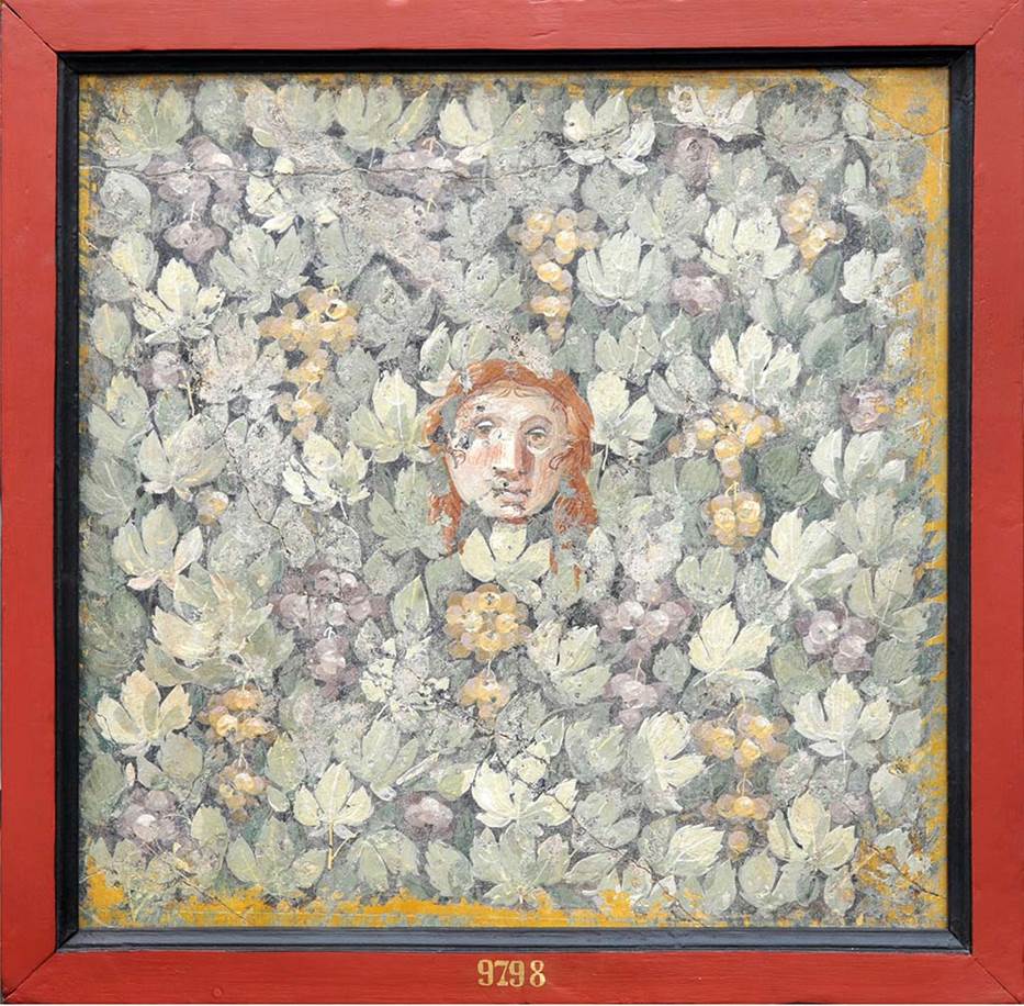 VII.14.9 Pompeii. Room 13, east wall of triclinium. The central painting showing the head of a Maenad looking out between foliage and bunches of grapes
Now in Naples Archaeological Museum. Inventory number 9798.