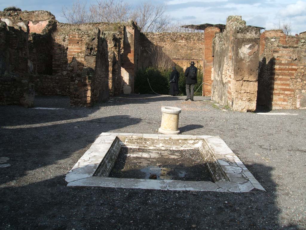 VII.14.9 Pompeii. December 2004. Room 1, looking north across impluvium in atrium.