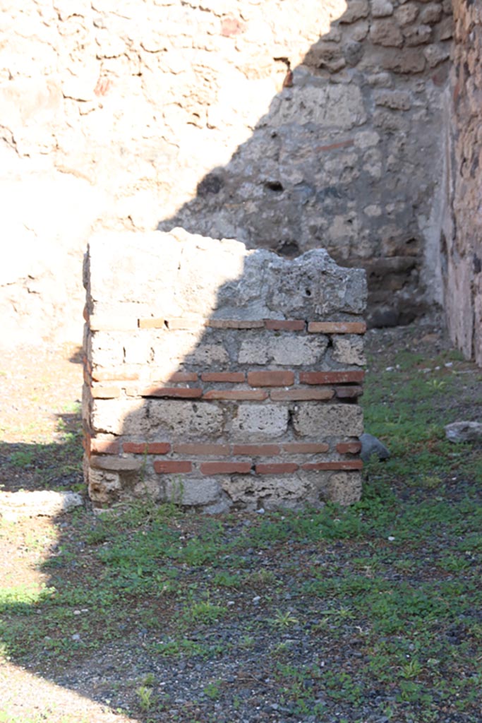 VII.14.12 Pompeii. October 2022. 
Looking north from shop-room towards wall pilaster separating two rear rooms.
Photo courtesy of Klaus Heese.