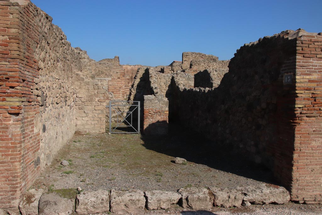 VII.14.13 Pompeii. October 2022. Looking north across entrance doorway into shop-room. Photo courtesy of Klaus Heese.