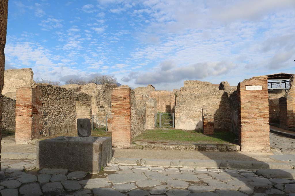 VII.14.14 Pompeii on right. December 2018. 
Looking north to entrance doorways, with VII.14.13 behind fountain on left. Photo courtesy of Aude Durand.