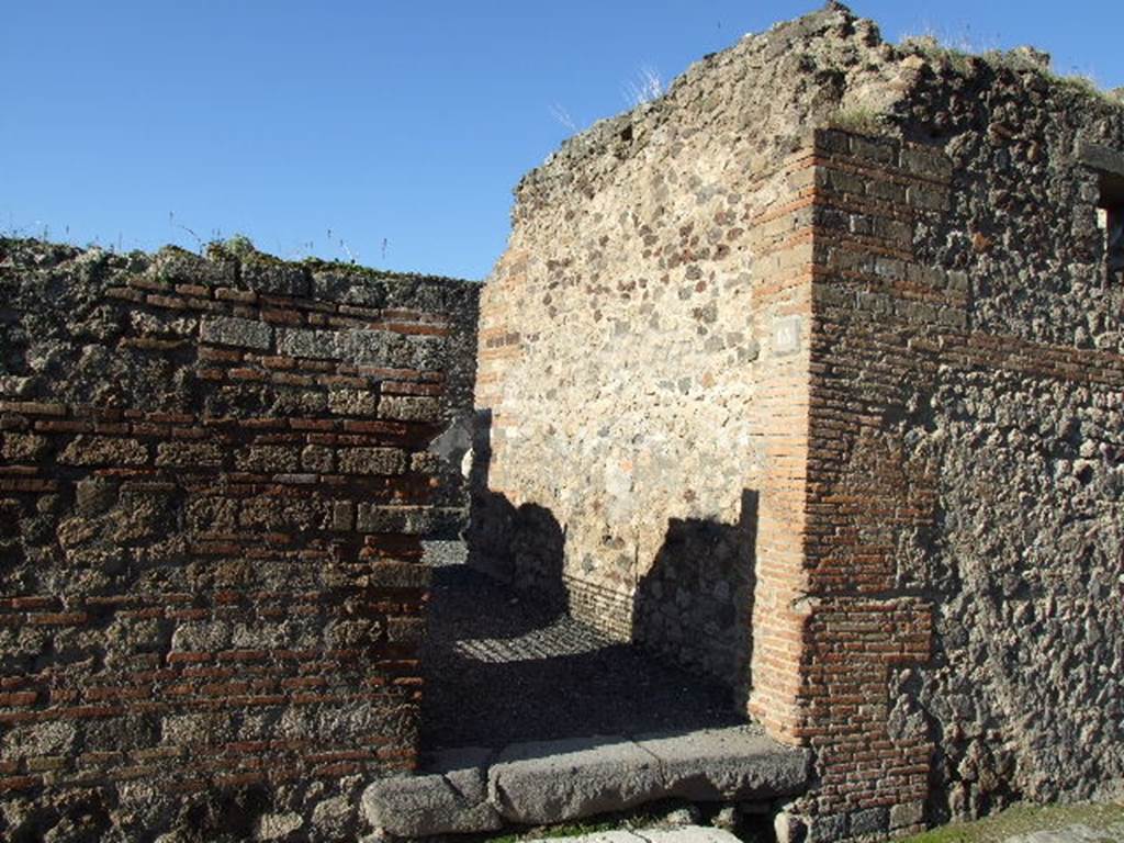 VII.14.15 Pompeii. December 2006. Entrance doorway, looking west from Vicolo del Lupanare.