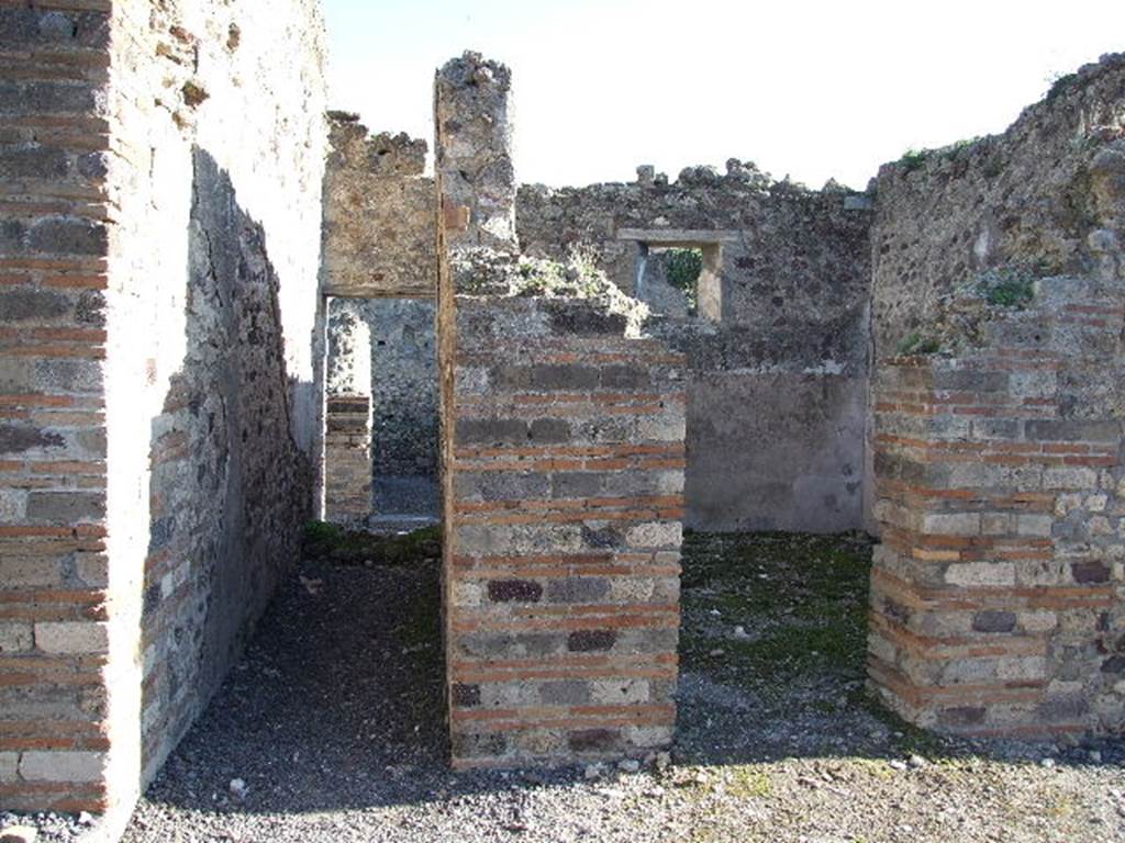 VII.14.15 Pompeii. December 2006. Looking east from atrium to doorway to oecus on north side of entrance corridor, on right. On the left, would have been the staircase from entrance at VII.4.16 to upper level.