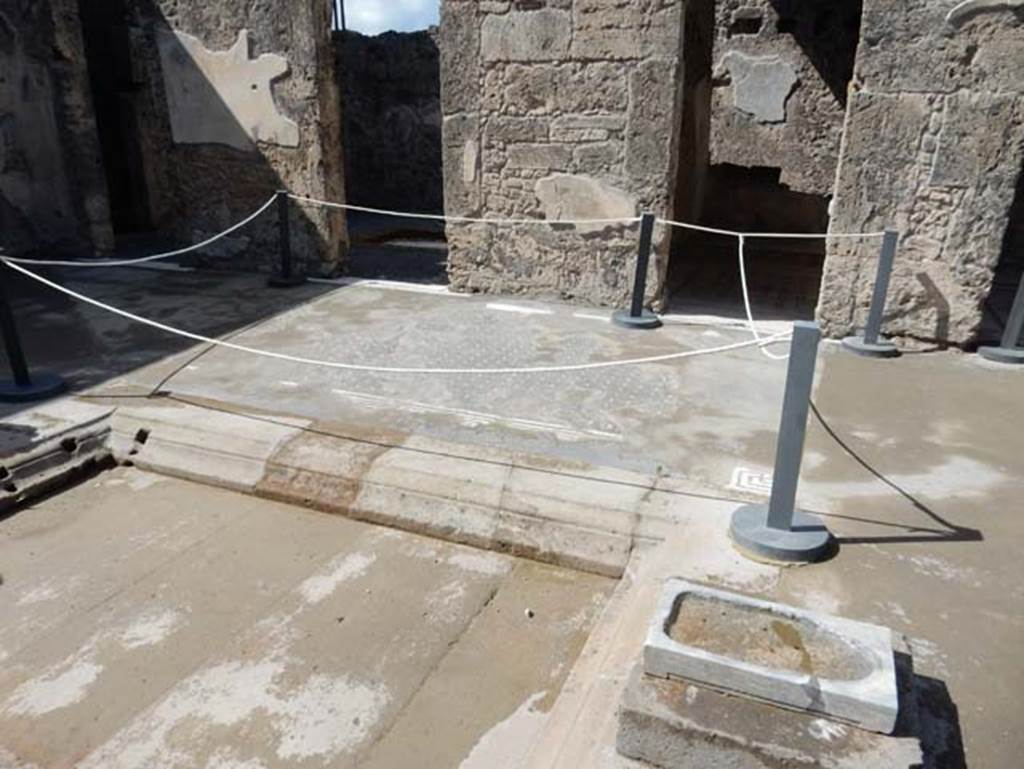 VII.15.2 Pompeii. May 2018. Doorways to rooms on west side of atrium. 
On the extreme left are two doorways connecting to the atrium of VII.15.1, and on the right is a doorway to a cubiculum. 
Seen on the pilaster, to the left, would have been “Summer”.
On the centre pilaster, but now completely devoid of plaster, would have been “Autumn”.
Photo courtesy of Buzz Ferebee. 
According to PPM - 
“Already in the excavation reports it was stated that one of the figures of the Seasons was completely destroyed, in particular “Autumn” was missing, which would have to have been found on the north side of the west wall between the doorways to the secondary atrium and the cubiculum.”
See Carratelli, G. P., 1990-2003. Pompei: Pitture e Mosaici: Vol. VII. Roma: Istituto della enciclopedia italiana, (p.714).