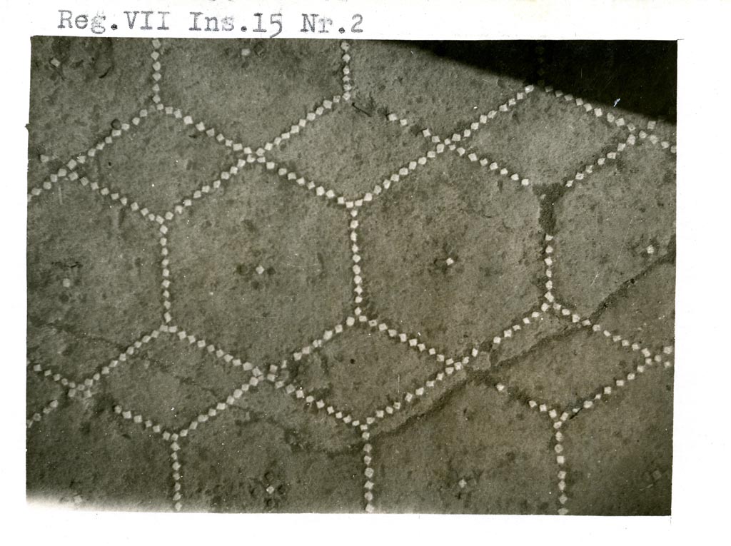 VI.15.2 Pompeii. Pre-1937-39. 
Flooring in apodyterium, or exedra/lounging room, made of cocciopesto with a net of hexagons and diamonds and a cross with four small black tiles and a central small white tile. Around the edge of the floor was a single line of small white tiles. 
Photo courtesy of American Academy in Rome, Photographic Archive. Warsher collection no. 1309.