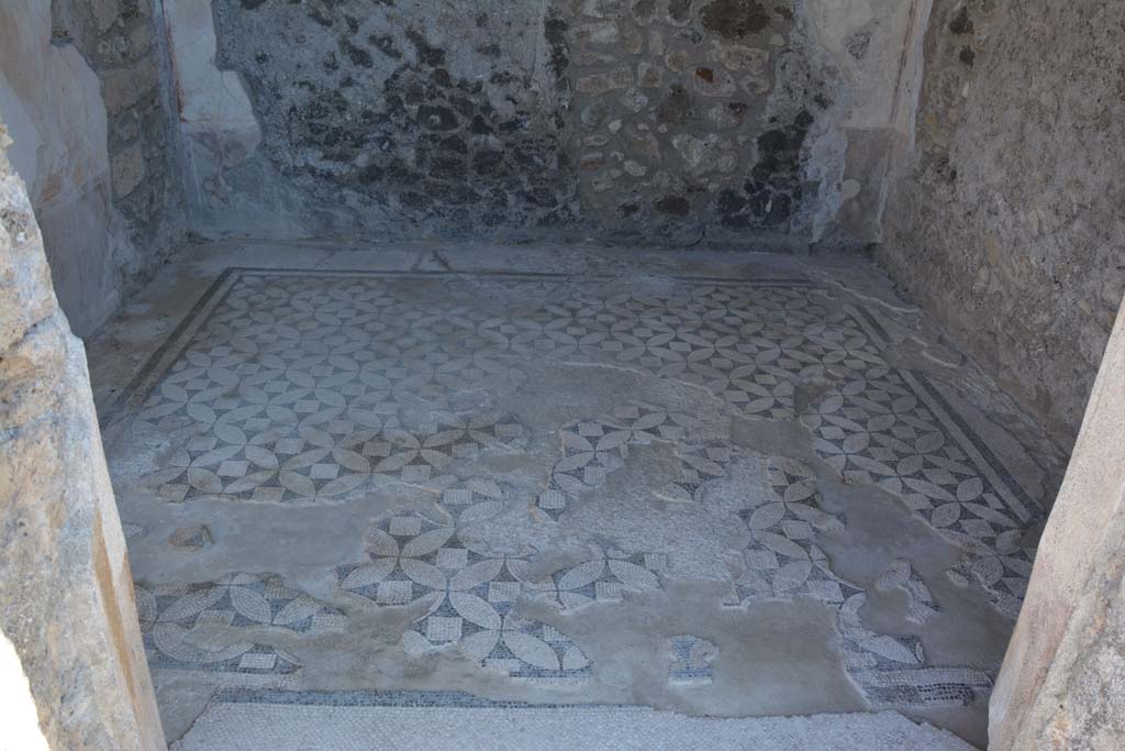VII.15.2 Pompeii. October 2019. Looking east across flooring, through doorway to cubiculum on north-east side of atrium. 
Foto Annette Haug, ERC Grant 681269 DÉCOR.
