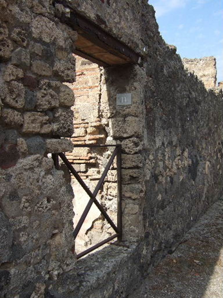 VII.15.11 Pompeii. September 2005. Entrance doorway leading to garden area, and rear of house.