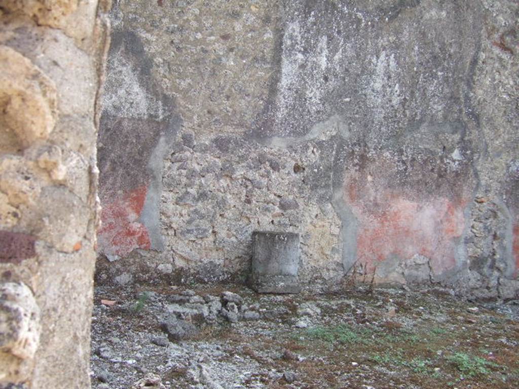VII.15.11 Pompeii. September 2005. Garden area.  Looking south towards south-east corner with remains of bench or raised planting bed.
According to Jashemski, the small garden which was excavated in 1872-3 was at the rear of the house. It had a roofed passageway on the north and west side. A low wall separated the garden from the passageway. There was a bench (or raised planting bed?) along the east and south walls.  See Jashemski, W. F., 1993. The Gardens of Pompeii, Volume II: Appendices. New York: Caratzas. (p.200)