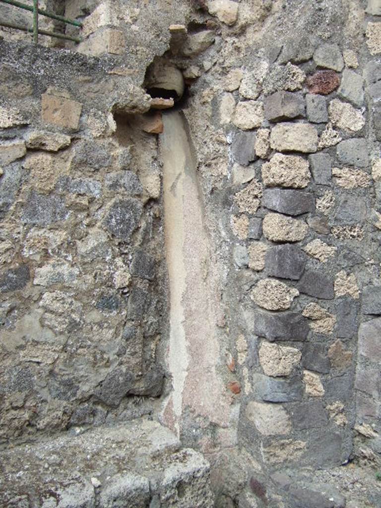 VII.15.16 Pompeii. May 2006. Granary. Room C to the east of the entrance.  
A wide terracotta pipe opens into the room. A long chute runs from this to the ground level.
There are platforms on either side of the chute.