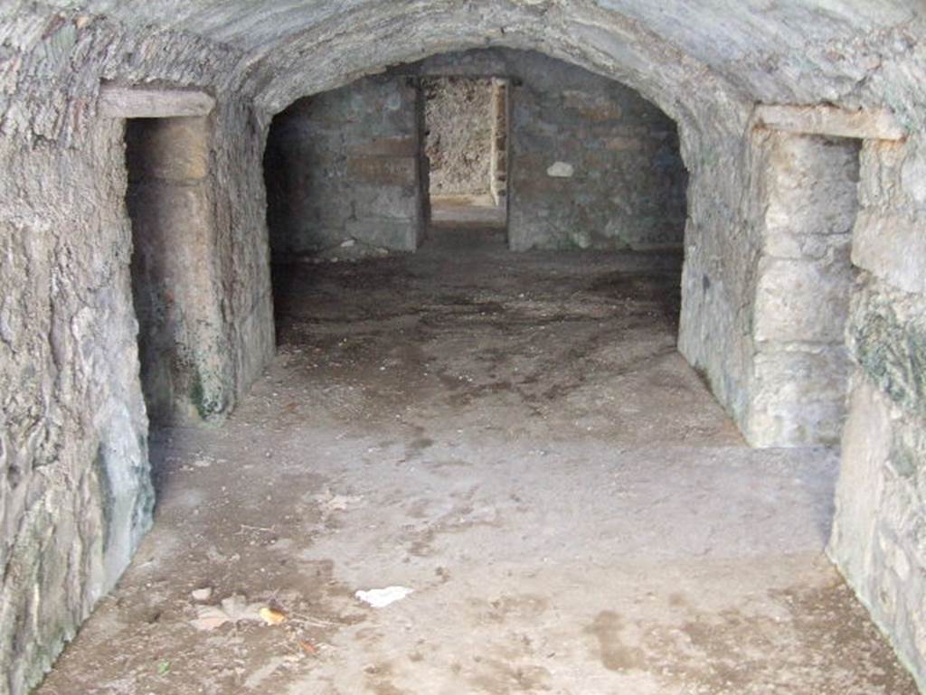 VII.15.16 Pompeii. September 2005. Looking south along vaulted corridor (A) of the granary.