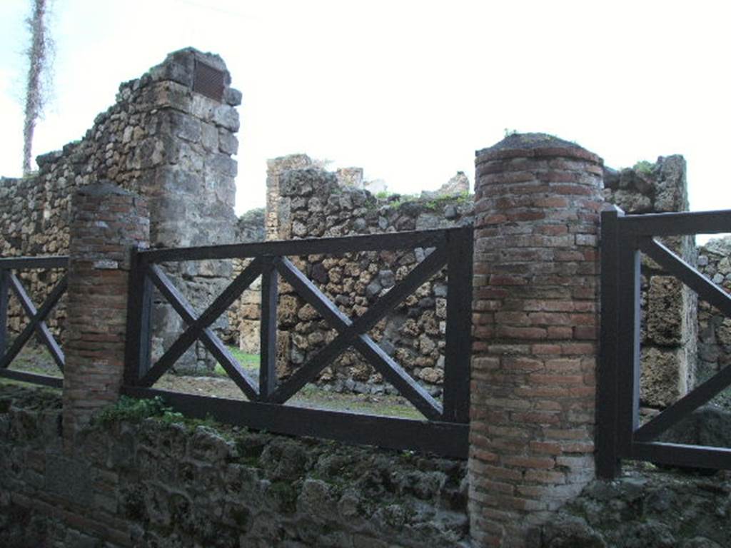 VII.16.1 Pompeii. September 2005. Entrance doorway at west end of porticus.