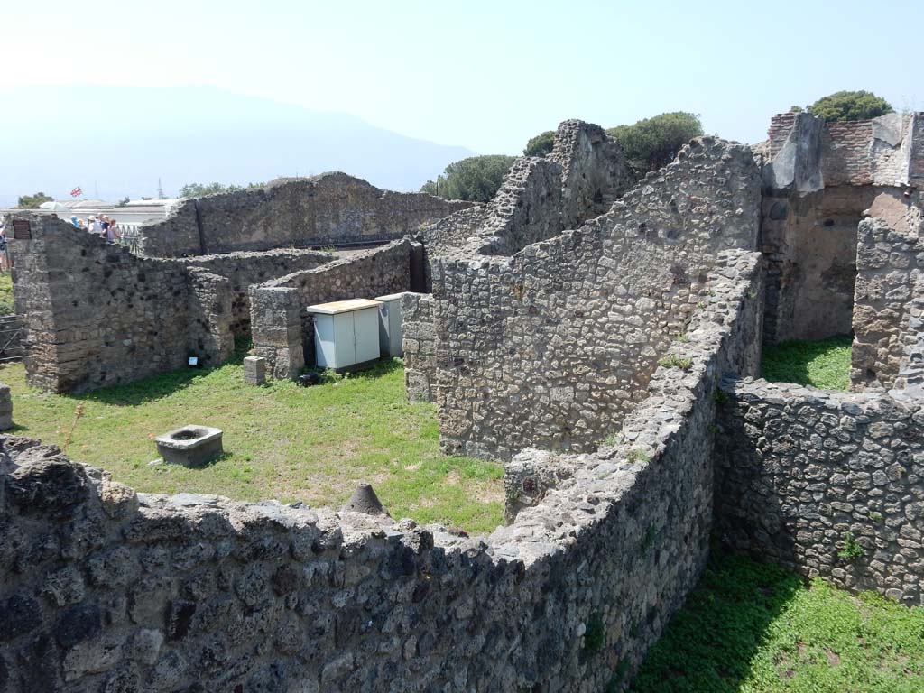 VII.16.1 Pompeii. June 2019.  Looking south-west (from VII.16.10) across wall of tablinum, on north side of atrium. 
Photo courtesy of Buzz Ferebee.