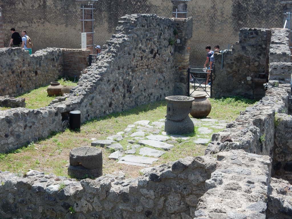 VII.16.6 Pompeii. June 2019. Looking south across workshop towards entrance doorway.
Photo courtesy of Buzz Ferebee.