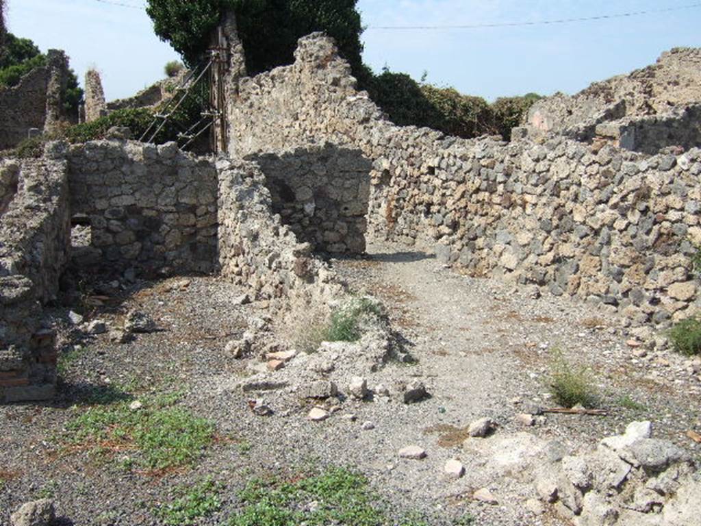 VII.16.9 Pompeii, on left, and side room, perhaps storeroom on right. September 2005.
According to Eschebach, this was a two-roomed bakery, with an oven at the rear.
On the right may have been stairs to the upper floor.
See Eschebach, L., 1993. Gebäudeverzeichnis und Stadtplan der antiken Stadt Pompeji. Köln: Böhlau. (p.347)
According to Garcia y Garcia, this bakery was totally destroyed in the 1943 bombardment.
The oven has now disappeared.
See Garcia y Garcia, L., 2006. Danni di guerra a Pompei. Rome: L’Erma di Bretschneider. (p.131)
