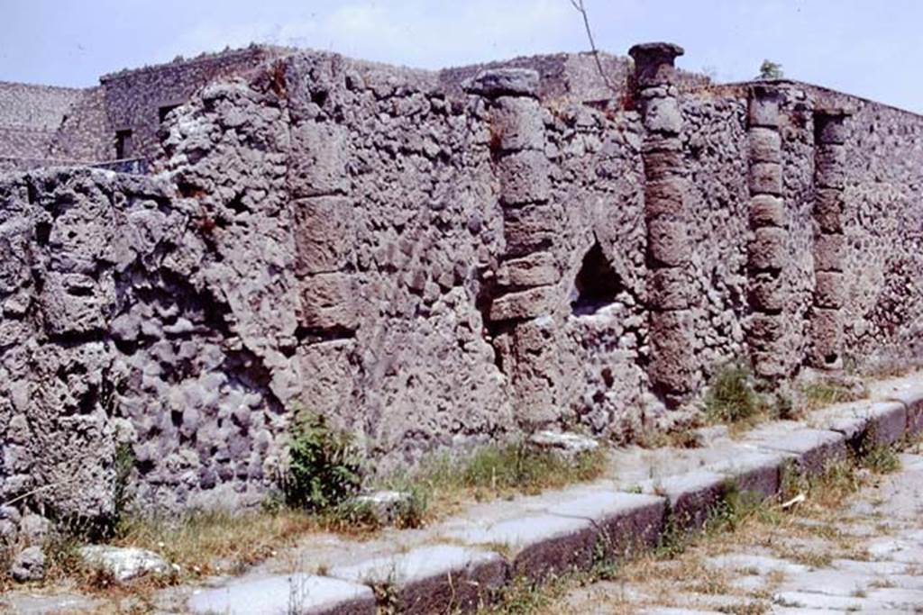 South perimeter wall of VII.16.17 with half columns, Pompeii. 1973. Vicolo dei Soprastanti, looking east.  Photo by Stanley A. Jashemski. 
Source: The Wilhelmina and Stanley A. Jashemski archive in the University of Maryland Library, Special Collections (See collection page) and made available under the Creative Commons Attribution-Non Commercial License v.4. See Licence and use details. J73f0195