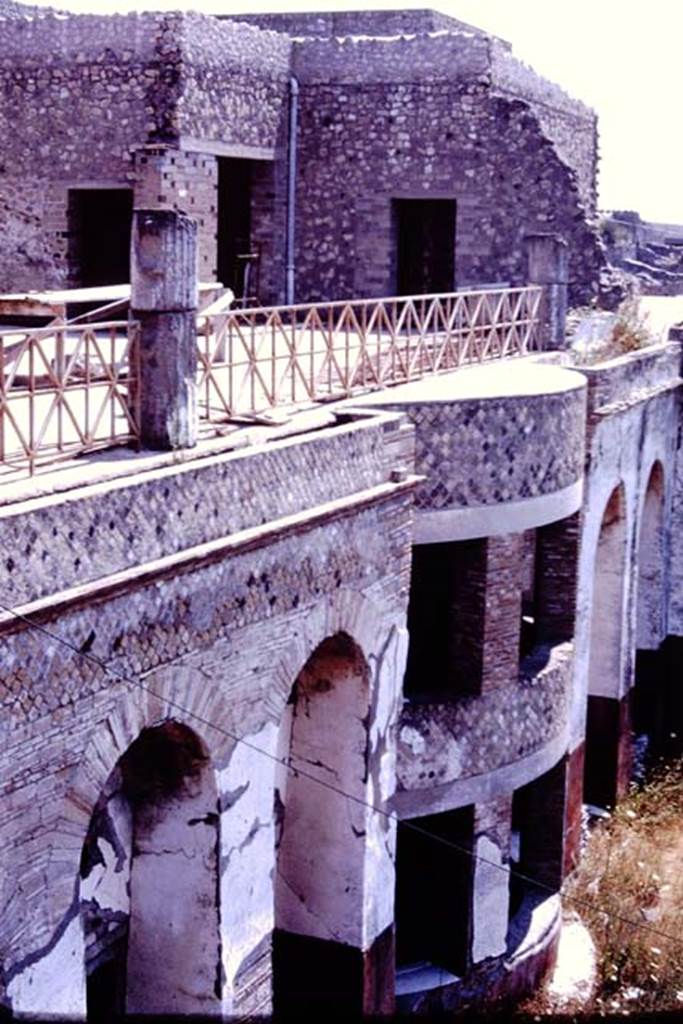 VII.16.17-22 Pompeii. 1977. Looking south-east across upper terrace portico, and down to lower levels. Photo by Stanley A. Jashemski.   
Source: The Wilhelmina and Stanley A. Jashemski archive in the University of Maryland Library, Special Collections (See collection page) and made available under the Creative Commons Attribution-Non Commercial License v.4. See Licence and use details. J77f0415