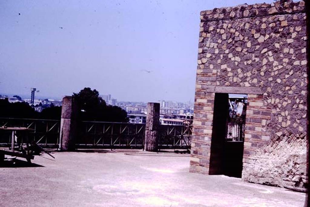 VII.16.17-22 Pompeii. 1977. Looking north-west across upper terrace portico, from the area of the stately oecus. Photo by Stanley A. Jashemski.   
Source: The Wilhelmina and Stanley A. Jashemski archive in the University of Maryland Library, Special Collections (See collection page) and made available under the Creative Commons Attribution-Non Commercial License v.4. See Licence and use details. J77f0417