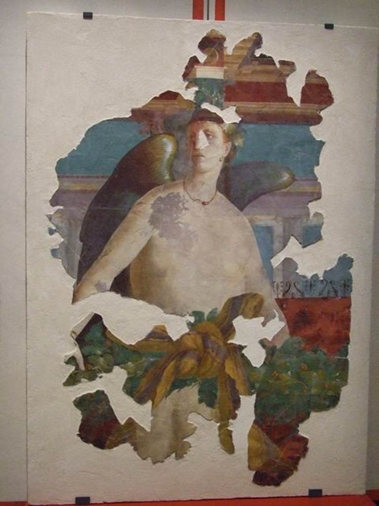 VII.16.17-22 Pompeii. Wall painting of winged female figure, possibly Victoria. PAP 41653. 
Photographed at “A Day in Pompeii” exhibition at Melbourne Museum. September 2009.
This may have come from the area of oecus 32 and may be the II style winged Nike.
This room has not been photographed.
Or, VI.17.41 Pompeii, according to PPM –
“This painting has been wrongly attributed to the tablinum of VI.17.41, the pieces recomposed from numerous fragments and shows a flying female Genius. The characteristics of the figure do not seem to agree with the recognisable remains from the north wall of the tablinum, therefore one must think that the fragments had been found in this area during the excavation in the 1950’s and perhaps belong to the decoration of oecus 15 in the south-west of the house at VI.7.41, or of triclinium 20 in the north-west corner of the same house.”
See Carratelli, G. P., 1990-2003. Pompei: Pitture e Mosaici. VI. (6). Roma: Istituto della enciclopedia italiana, (p.20, no.22/23.)