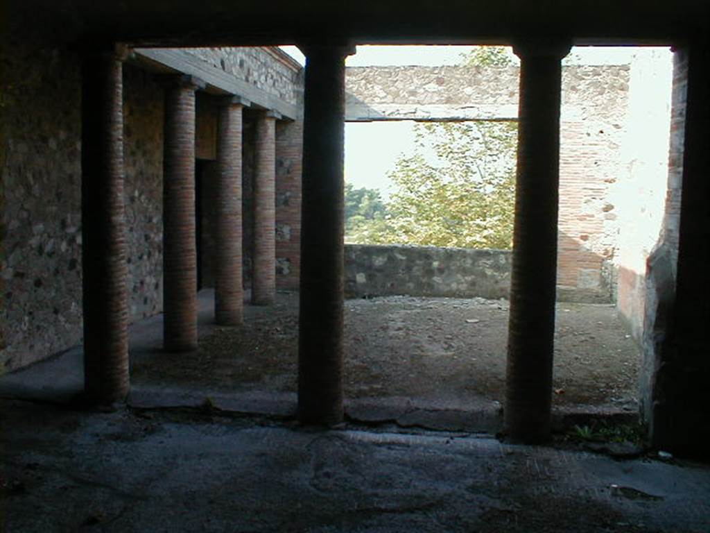 VII.16.17-22 Pompeii. December 2007. Peristyle 14, looking west across paved courtyard in House of Maius Castricius.
According to Jashemski, to the west of the peristyle garden was a paved courtyard with a portico on the south and the east.
A large window in the west wall looked down on the garden below, and to the Bay of Naples beyond.
This courtyard was probably decorated with potted plants and trees.
See Jashemski, W. F., 1993. The Gardens of Pompeii, Volume II: Appendices. New York: Caratzas. (p.203, C, and Fig. 237)