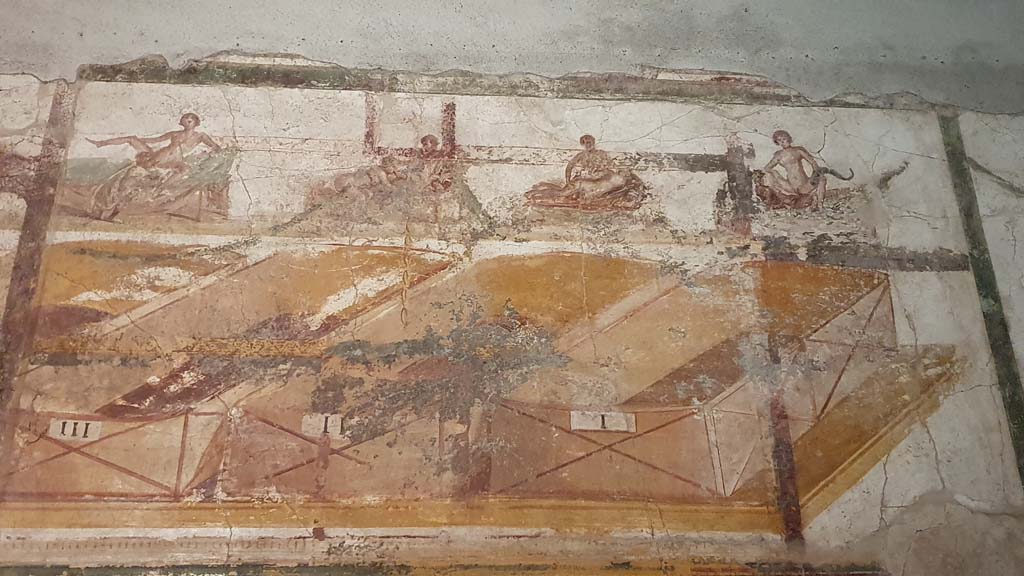 VII.16.a Pompeii. August 2021. Room 7, erotic paintings on upper south wall, showing four figures numbered III, II, and I.
The figure on the left is numbered IIII, but number not seen in the photo.
Foto Annette Haug, ERC Grant 681269 DÉCOR.
.