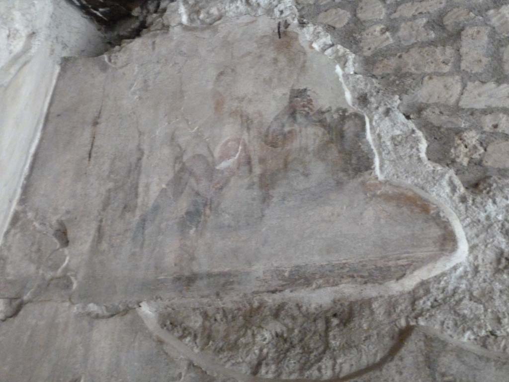 VII.16.a Pompeii. May 2010. 
Corridor B. Wall painting of gladiator on upper part of corridor B. The gladiator is lying on his back with his legs bent.