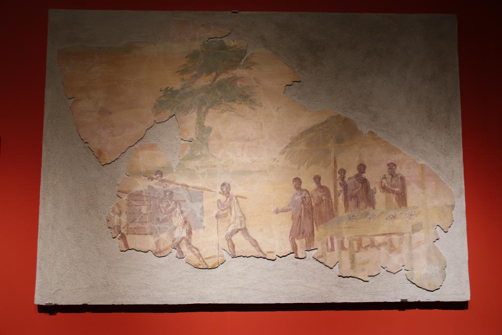 VII.16.a Pompeii. May 2024. 
Painting of market scene, on display in exhibition in palaestra, entitled “L’altra Pompei, vite comuni all’ombra del Vesuvio”. 
Photo courtesy of Klaus Heese.