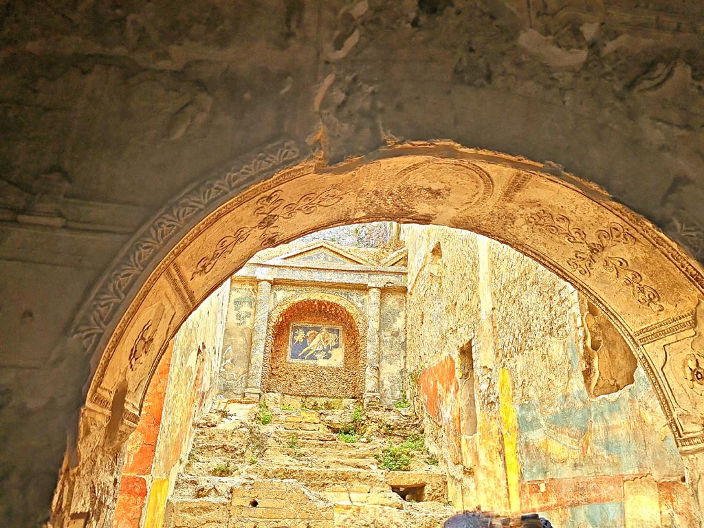 VII.16.a Pompeii. November 2023. 
Room 6, looking east with detail of stuccoed arch leading to room 9, natatio with nymphaeum. Photo courtesy of Giuseppe Ciaramella.