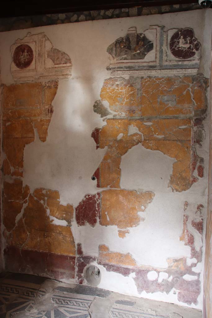 VII.16.a Pompeii. October 2020. 
Room 1, north wall with pipe protruding from lower wall in centre. Photo courtesy of Klaus Heese.