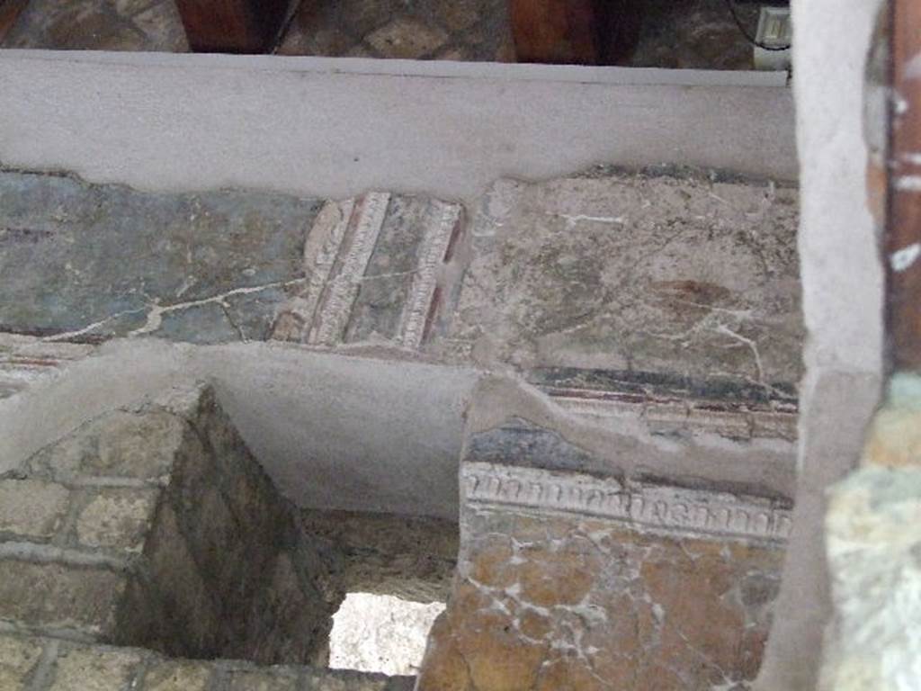 VII.16.a Pompeii. December 2006. Room 1, painted stucco on the  east wall in the south-east corner.