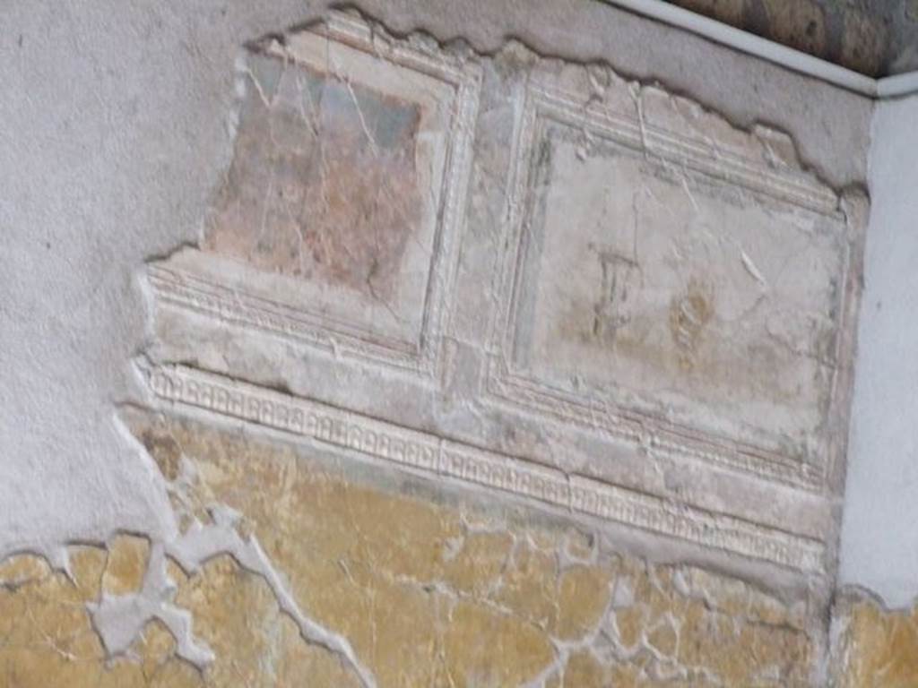 VII.16.a Pompeii. December 2006. Room 1, plasterwork and painted decoration on the west wall in the north-west corner.