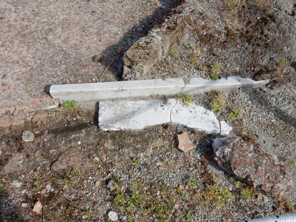 VII.16.a Pompeii. May 2015.  Remains of marble at ground level, near debris. Photo courtesy of Buzz Ferebee.