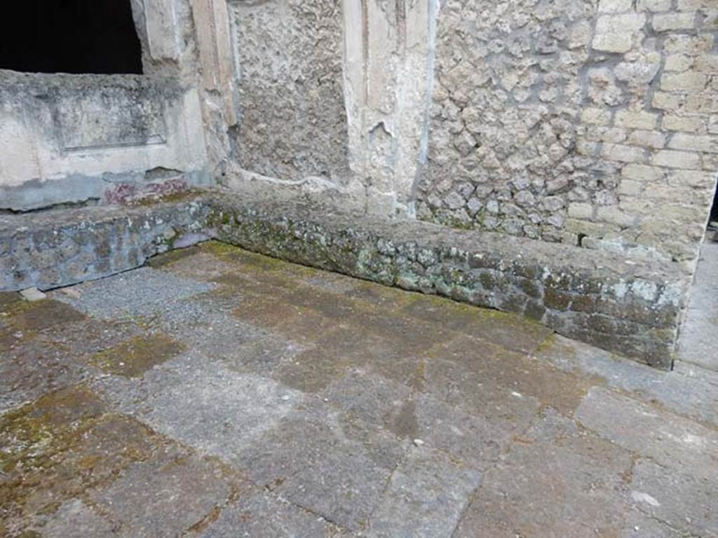VII.16.a Pompeii. May 2015. Benches in courtyard C, against exterior wall of room with two small windows.  Photo courtesy of Buzz Ferebee.