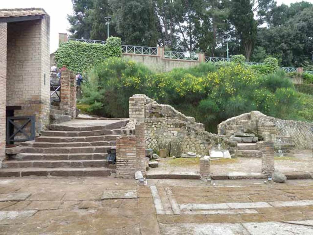 VII.16.a Pompeii. May 2010. Looking south from courtyard C, to steps to roadway, and upper steps leading east to portico.