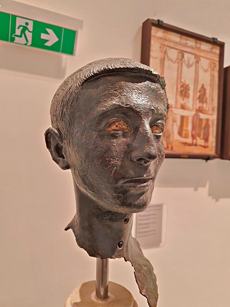 VIII.1.1 Pompeii. April 2023. Detail of bronze bust of a young unknown man, found in the Basilica. 
On display in “Campania Romana” gallery in Naples Archaeological Museum. Photo courtesy of Giuseppe Ciaramella.