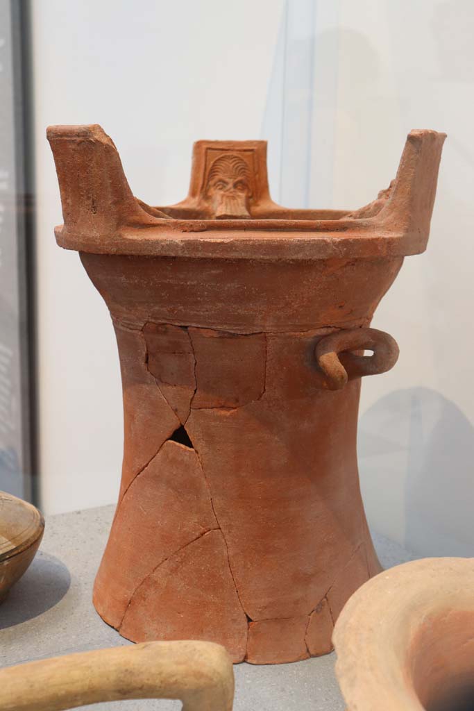VIII.1.4 Pompeii. February 2021. 
Brazier with heads of Silenus, made in Asia Minor (western coast of Turkey).
Found in a dump on the western side of the Forum.
Photo courtesy of Fabien Bièvre-Perrin (CC BY-NC-SA).