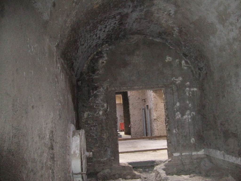 VIII.1.4 Pompeii Antiquarium. December 2005. Exit room with cast of a wheel on left.
In this room were also displayed the casts of a tree, a cupboard, and the crouching man found in the Palaestra.
The wheel, fixed to the wall, was the only item that remained after the 1978 closure and relocation of items.