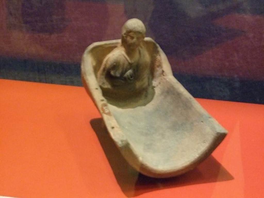 I.14.15 Pompeii. Terracotta altar in the shape of a cradle. SAP inventory number 34973.
Photographed at “A Day in Pompeii” exhibition at Melbourne Museum. September 2009.