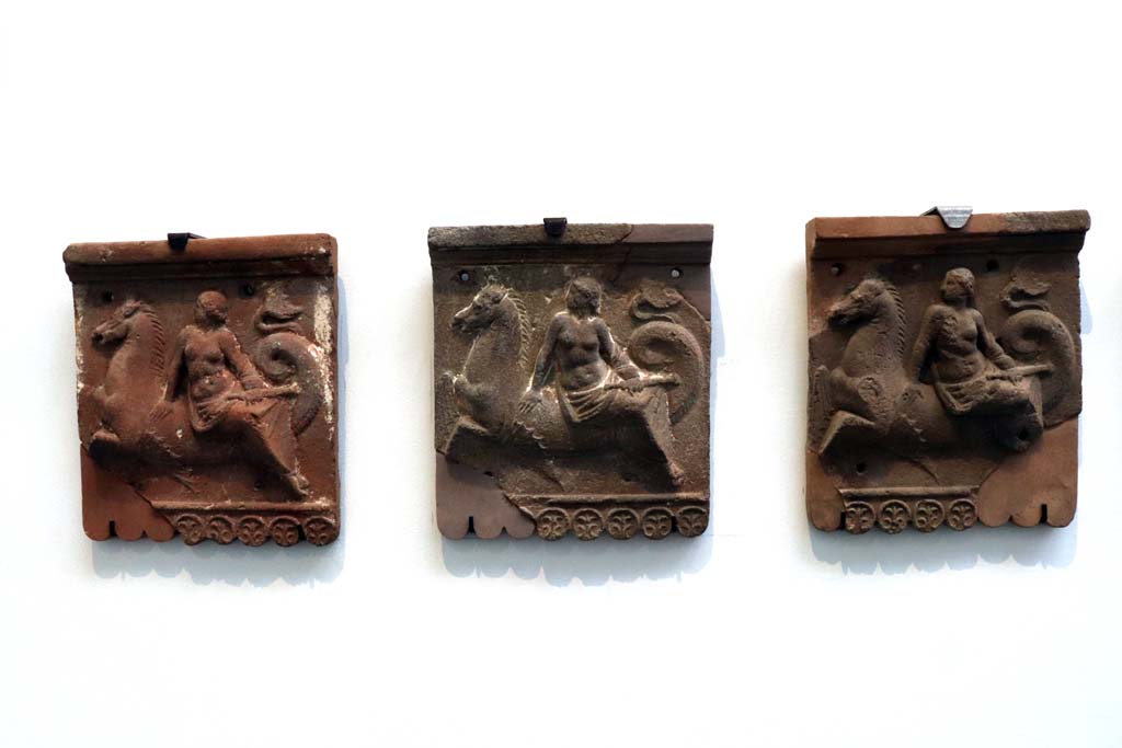 VIII.1.4 Pompeii. February 2021. Terracotta slabs with nereids on tritons (from Pompeii). 
Photo courtesy of Fabien Bièvre-Perrin (CC BY-NC-SA).