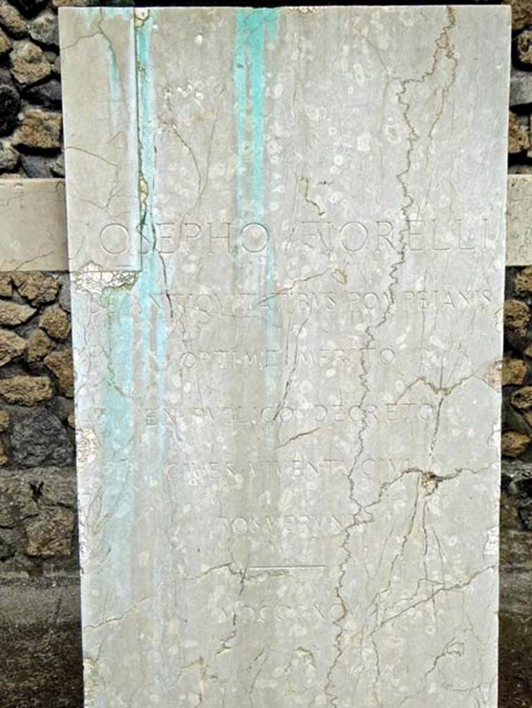 Larario dei Pompeianisti. Pompeii. September 2016. Bust of Iosepho Fiorelli.  
The inscription on the front of the pedestal reads:
          IOSEPHO FIORELLI
DE ANTIQVITA TIBUS POMPEIANIS
            OPTIME MERITO
       EX PVBLICO DECRETO
          CIVES VIVENTI CIVI
             POSVERVNT
              MDCCCXCV
Photo courtesy of Michael Binns.