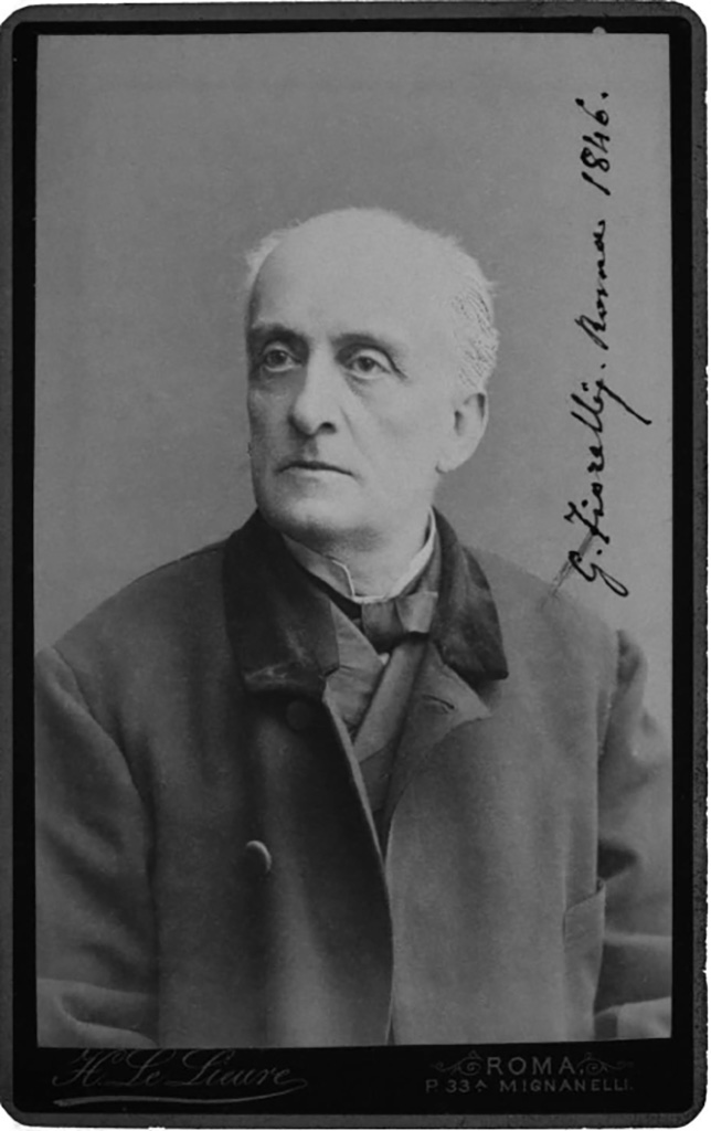 Larario dei Pompeianisti. Pompeii. Photo of Giuseppe Fiorelli (7 June 1823 – 28 January 1896) by Henri Le Lieure.
The handwritten  date would seem to be wrong. 
In 1870 Le Lieure moved to Rome, following the Royal family and the Parliament, so the photo should be after that date.
DAIR A.451. Photo © Deutsches Archäologisches Institut, Abteilung Rom, Arkiv.
