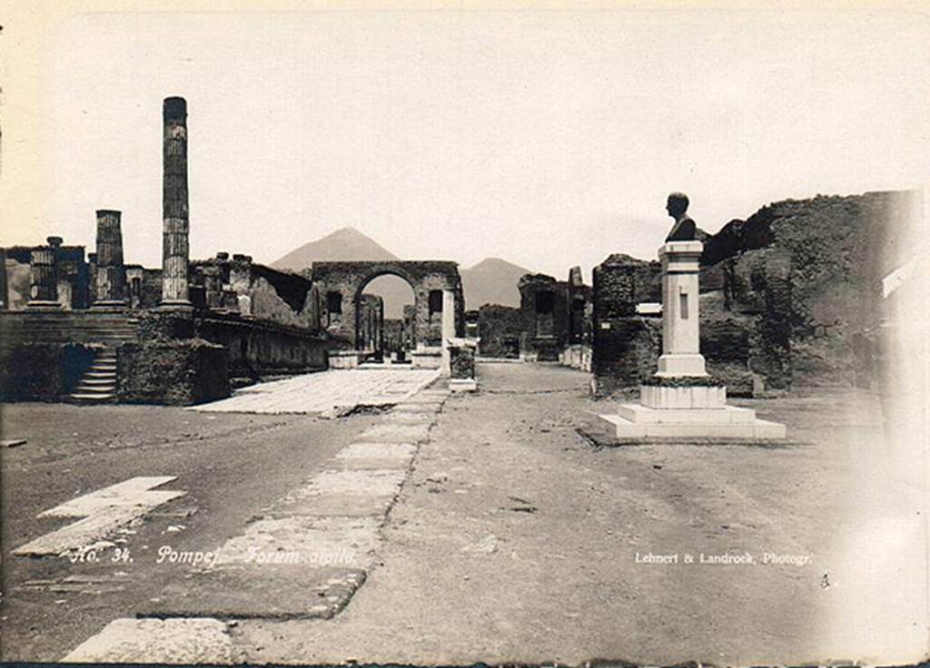 VII.8 Pompeii Forum. 1910. Bust of Giuseppe Fiorelli, now in the Larario dei Pompeianisti. Photo courtesy of Ross Turner.
The bronze bust of Fiorelli was erected in the Forum at Pompeii in 1895, a year before his death.  
The inscription on the front of the pedestal reads:
          IOSEPHO FIORELLI
DE ANTIQVITA TIBUS POMPEIANIS
            OPTIME MERITO
       EX PVBLICO DECRETO
          CIVES VIVENTI CIVI
             POSVERVNT
              MDCCCXCV