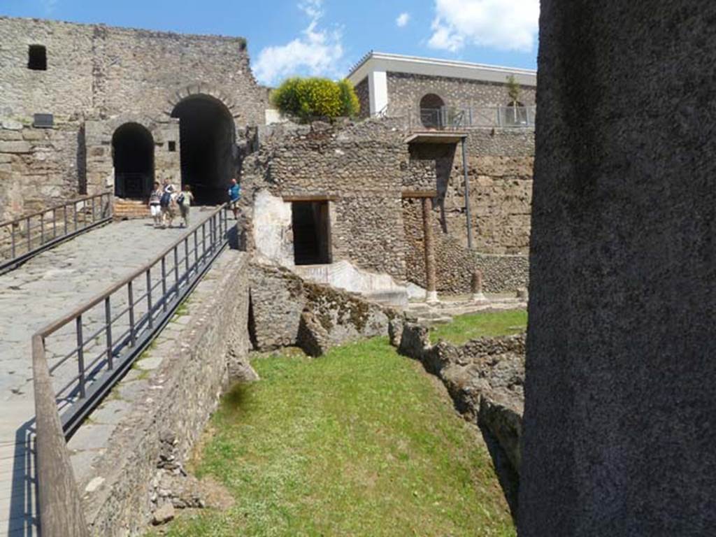 VIII.1.a Pompeii. May 2011. Looking east to stairs at north end of portico, and Porta Marina.  Photo courtesy of Michael Binns.