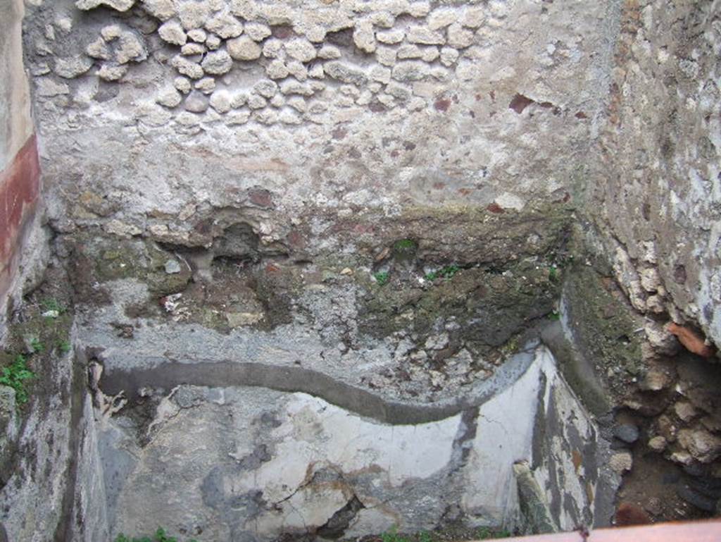VIII.2.1 Pompeii. December 2005. Cubiculum on upper level, without floor on east side of tablinum, and lower room.According to Breton, the cubiculum would have been a beautiful room, when excavated the paintings were nearly all faded. See Breton, Ernest. 1870. Pompeia, Guide de visite a Pompei, 3rd ed. Paris, Guerin, (p.502).