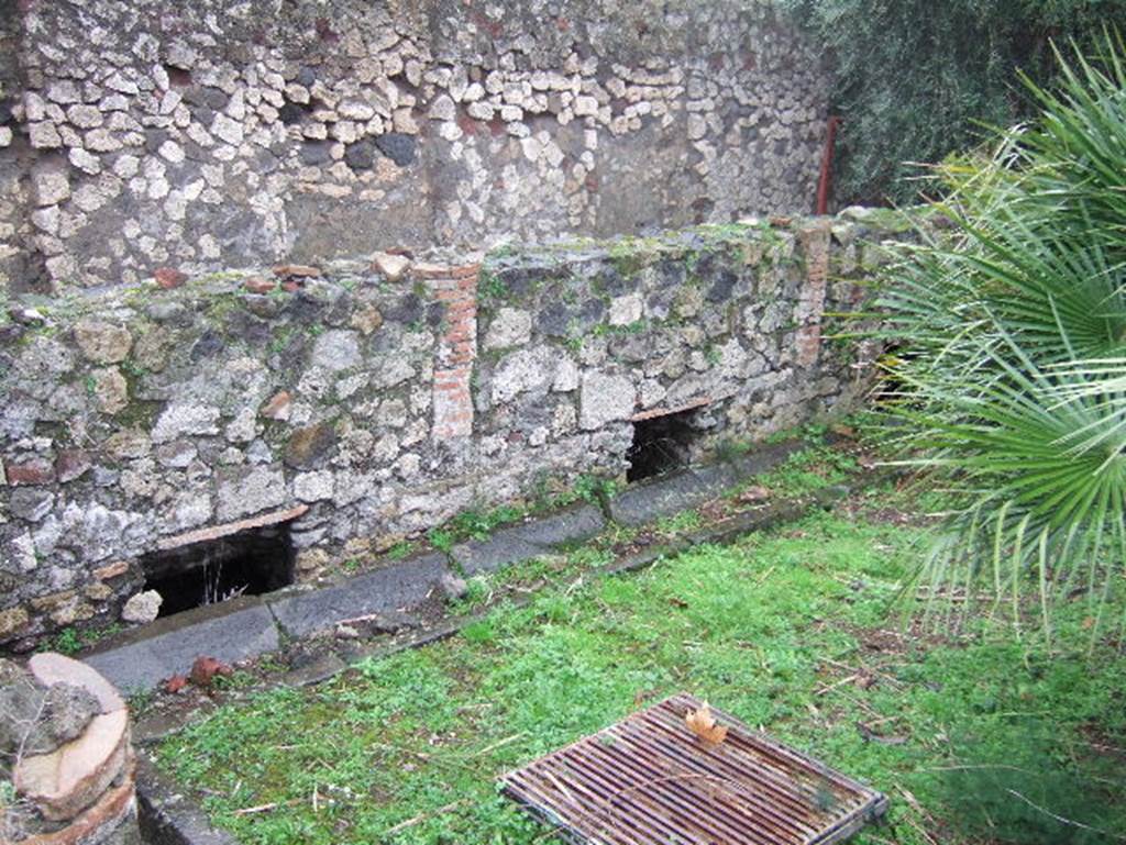 VIII.2.1 Pompeii. December 2005. Looking towards east side of garden area. In order to give light to the rooms below, openings were cut in the floor which supported the columns. Around the edges of the garden was a gutter. See Jashemski, W. F., 1993. The Gardens of Pompeii, Volume II: Appendices. New York: Caratzas. (p.205)