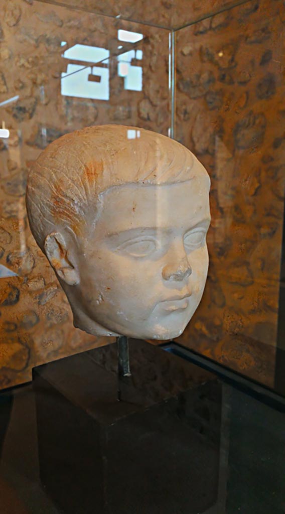VIII.2.1 Pompeii. 2018. On display in Championnet complex Pompeii. 
Marble head of a child, found 9th February 1937. Photo courtesy of Giuseppe Ciaramella.