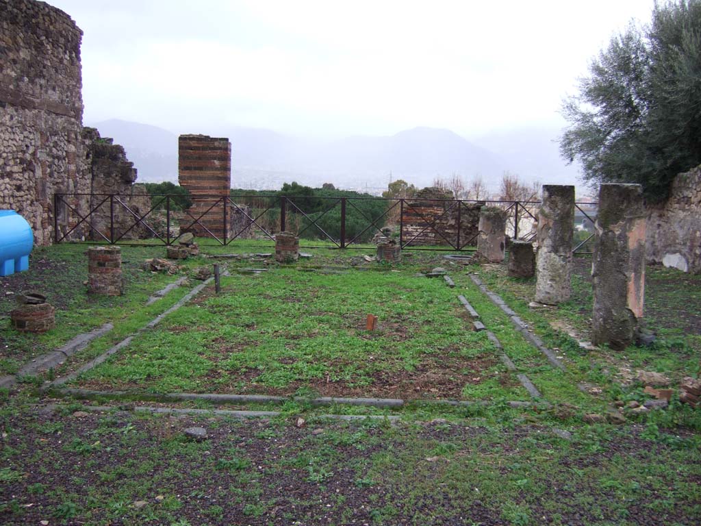 VIII.2.3 Pompeii. December 2005. Looking south across peristyle garden.
According to Jashemski, this peristyle garden, was enclosed on four sides by a portico supported by fourteen columns.  
Off the north-west corner of the peristyle was a small room which Mazois and Fiorelli call a sacrarium. 
At the rear, there was a terrace.
See Jashemski, W. F., 1993. The Gardens of Pompeii, Volume II: Appendices. New York: Caratzas. (p.205)