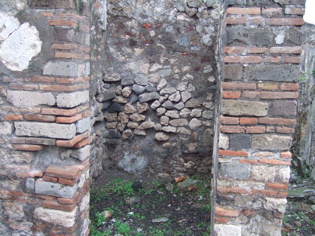 VIII.2.3 Pompeii. December 2005. Small room on north-west corner of the peristyle.  
According to Boyce, off the north-west corner of the peristyle opened a small room which Mazois and Fiorelli called the lararium.
See Boyce G. K., 1937. Corpus of the Lararia of Pompeii. Rome: MAAR 14. (p.74, no.342)